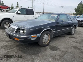 1987 Chrysler LeBaron z VIN 1C3CJ51E1HG137845, wystawiony jako Copart lot #86610254 z przebiegiem Nie podano mil oraz Tytuł czysty. Historia ofert i sprzedaży dostępna na DreamBid. Obrazek 1.
