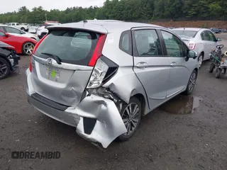 2015 Honda Fit EX-L z VIN 3HGGK5H82FM713988, wystawiony jako IAAI lot #42517762 z przebiegiem 56 169 mil mil oraz . Historia ofert i sprzedaży dostępna na DreamBid. Obrazek 4.