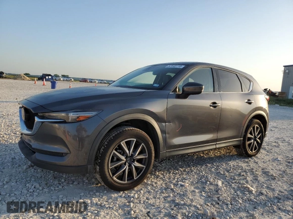 2017 Mazda CX-5 Grand Touring with VIN JM3KFBDL1H0148961, listed as a Copart auction lot 52648115 with 171,767 mi miles and Salvage Title. Bid and sale history available at carsss.com. Image 1.