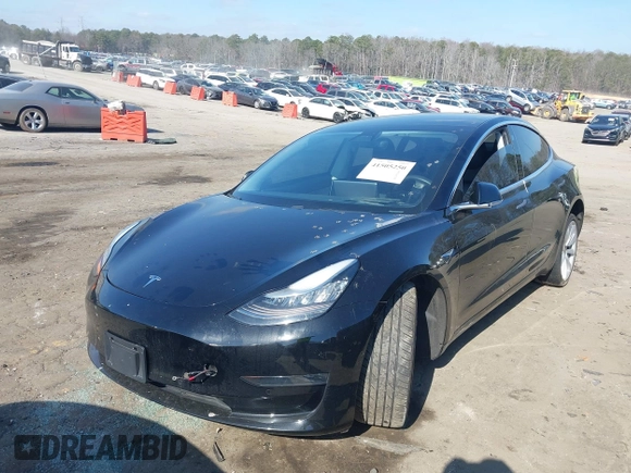 2020 Tesla Model 3 Standard Range Plus with VIN 5YJ3E1EA0LF660759, listed as a IAAI auction lot 41505250 with 63,322 mi miles and . Bid and sale history available at DreamBid. Image 2.
