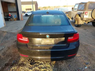 2015 BMW 2 Series 228i with VIN WBA1F5C55FV256604, listed as a IAAI auction lot 41841754 with 118,354 mi miles. Bid and sale history available at carsss.com. Image 16.