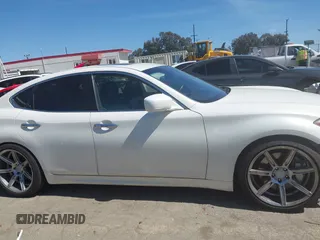2013 Infiniti M with VIN JN1BY1AP6DM511104, listed as a IAAI auction lot 41818184 with 138,605 mi miles and . Bid and sale history available at DreamBid. Image 14.