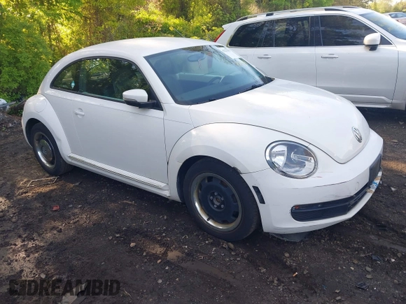 2012 Volkswagen Beetle 2.5L w/Sound/Nav PZEV with VIN 3VWJP7AT1CM619318, listed as a IAAI auction lot 42223291 with 85,989 mi miles and . Bid and sale history available at DreamBid. Image 1.