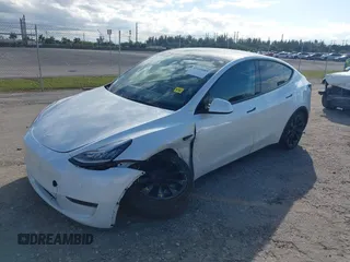 2023 Tesla Model Y Long Range z VIN 7SAYGDEE0PA128888, wystawiony jako IAAI lot #41410085 z przebiegiem 12 578 mil mil oraz . Historia ofert i sprzedaży dostępna na DreamBid. Obrazek 17.