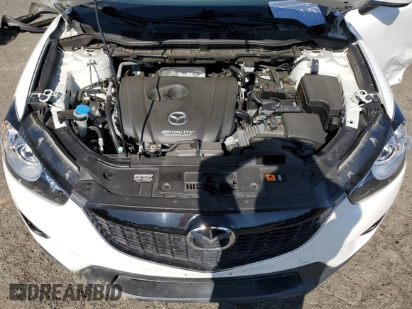 2014 Mazda CX-5 Grand Touring with VIN JM3KE4DY2E0354795, listed as a Copart auction lot 54205775 with 62,939 mi miles and Salvage Title. Bid and sale history available at DreamBid. Image 12.