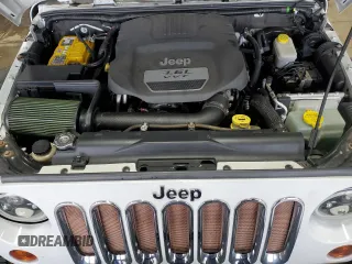 2013 Jeep Wrangler Rubicon 10th Anniversary z VIN 1C4BJWCGXDL543958, wystawiony jako Copart lot #58492255 z przebiegiem 94 455 mil mil oraz Szkoda całkowita • Salvage title. Historia ofert i sprzedaży dostępna na DreamBid. Obrazek 11.