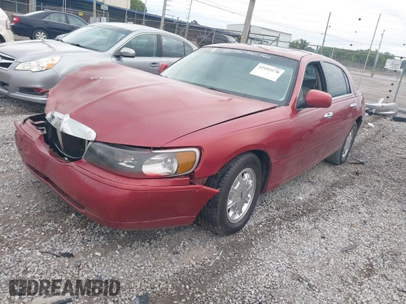1999 Lincoln Town Car Signature z VIN 1LNFM82WXXY601583, wystawiony jako IAAI lot #42193270 z przebiegiem Nie podano mil oraz . Historia ofert i sprzedaży dostępna na DreamBid. Obrazek 18.