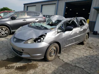 2009 Honda Fit with VIN JHMGE88259S008423, listed as a Copart auction lot 63012875 with 154,972 mi miles and Salvage title. Bid and sale history available at DreamBid. Image 1.