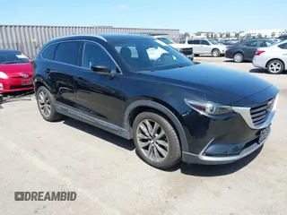 2016 Mazda CX-9 Grand Touring with VIN JM3TCBDY4G0113693, listed as a IAAI auction lot 41965857 with 152,403 mi miles and . Bid and sale history available at DreamBid. Image 1.