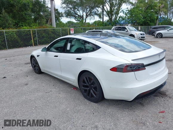 2022 Tesla Model S Plaid with VIN 5YJSA1E61NF460155, listed as a IAAI auction lot 42545167 with 51,711 mi miles and . Bid and sale history available at DreamBid. Image 3.