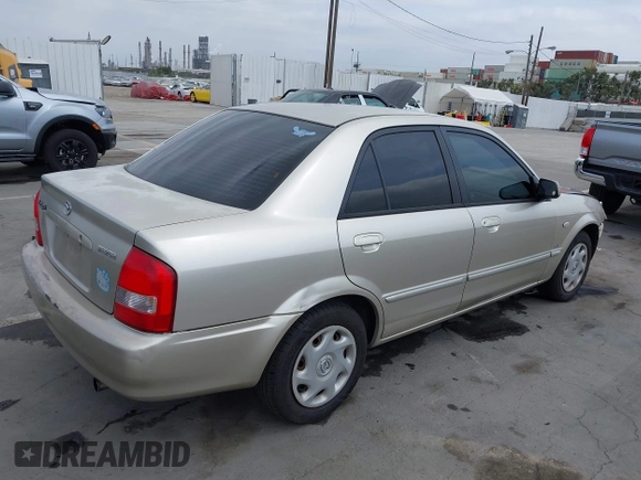 2002 Mazda Protege DX with VIN JM1BJ225121620394, listed as a IAAI auction lot 42043056 with 187,360 mi miles and . Bid and sale history available at DreamBid. Image 4.