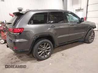 2016 Jeep Grand Cherokee Limited 75th Anniversary with VIN 1C4RJFBG2GC349154, listed as a IAAI auction lot 41392239 with 135,627 mi miles and . Bid and sale history available at DreamBid. Image 4.