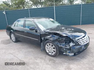 2009 Cadillac DTS 1SC z VIN 1G6KD57Y29U141800, wystawiony jako IAAI lot #42190874 z przebiegiem 115 043 mil mil oraz . Historia ofert i sprzedaży dostępna na DreamBid. Obrazek 1.