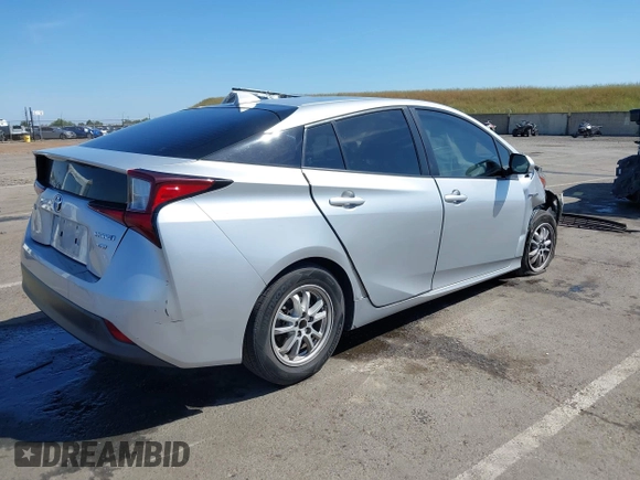2021 Toyota Prius L Eco with VIN JTDKAMFUXM3144991, listed as a IAAI auction lot 42147025 with 106,466 mi miles and . Bid and sale history available at DreamBid. Image 4.