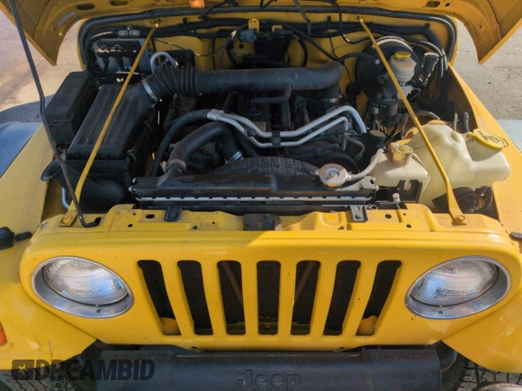 2004 Jeep Wrangler Sport z VIN 1J4FA49S64P751615, wystawiony jako Copart lot #55810895 z przebiegiem 128 165 mil mil oraz Szkoda całkowita • Salvage title. Historia ofert i sprzedaży dostępna na DreamBid. Obrazek 12.