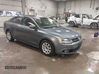 2014 Volkswagen Jetta TDI w/Premium with VIN 3VWLL7AJ4EM425825, listed as a IAAI auction lot 41519621 with 154,486 mi miles and . Bid and sale history available at DreamBid. Image 1.