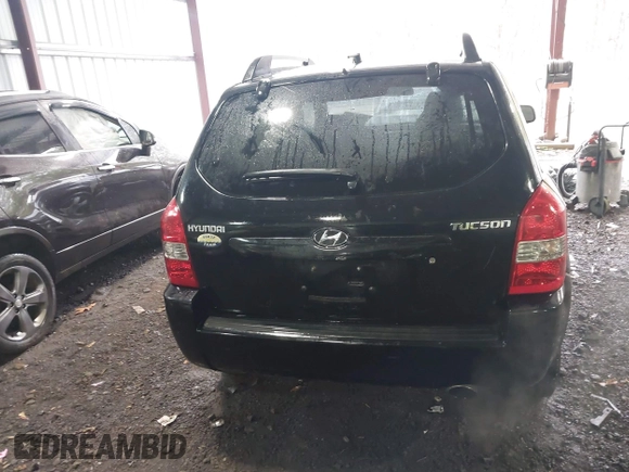 2005 Hyundai Tucson GL with VIN KM8JM12B75U072080, listed as a IAAI auction lot 41779464 with 191,771 mi miles. Bid and sale history available at carsss.com. Image 16.