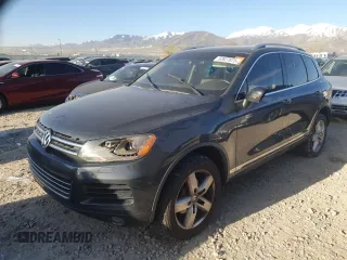 2012 Volkswagen Touareg Sport z VIN WVGFK9BP6CD001309, wystawiony jako Copart lot #52827875 z przebiegiem 153 250 mil mil oraz Czysty tytuł • Clean title. Historia ofert i sprzedaży dostępna na DreamBid. Obrazek 1.