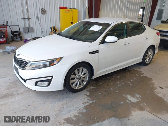 2015 Kia Optima LX with VIN KNAGM4A79F5616665, listed as a IAAI auction lot 42121526 with 153,022 mi miles. Bid and sale history available at carsss.com. Image 2.