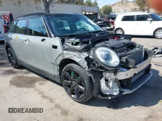 2016 MINI Clubman z VIN WMWLN5C56G2E31556, wystawiony jako IAAI lot #41977645 z przebiegiem 48 214 mil mil oraz . Historia ofert i sprzedaży dostępna na DreamBid. Obrazek 1.
