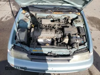 1994 Toyota Corolla Deluxe with VIN JT2AE09B4R0067104, listed as a Copart auction lot 83565064 with 207,923 mi miles and Salvage title. Bid and sale history available at DreamBid. Image 11.