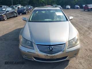 2006 Acura RL z VIN JH4KB16596C005876, wystawiony jako IAAI lot #42666228 z przebiegiem 146 897 mil mil oraz . Historia ofert i sprzedaży dostępna na DreamBid. Obrazek 6.