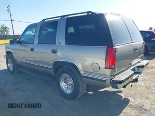 1999 Chevrolet Tahoe Z71 with VIN 1GNEK13R7XJ521373, listed as a IAAI auction lot 42131893 with 250,712 mi miles and . Bid and sale history available at DreamBid. Image 3.