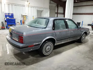 1991 Oldsmobile Cutlass Ciera with VIN 2G3AM54N8M2304905, listed as a Copart auction lot 52047535 with 28,749 mi miles and Salvage Title. Bid and sale history available at DreamBid. Image 3.