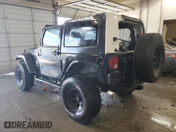2009 Jeep Wrangler Sahara with VIN 1J4FA54159L772622, listed as a Copart auction lot 55648305 with 141,880 mi miles and Salvage title. Bid and sale history available at DreamBid. Image 2.