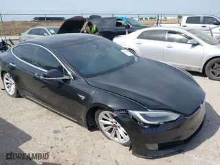 2016 Tesla Model S 90D with VIN 5YJSA1E2XGF167998, listed as a IAAI auction lot 42019913 with 126,258 mi miles. Bid and sale history available at carsss.com. Image 1.