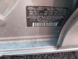 2012 Hyundai Elantra GLS PZEV with VIN KMHDH4AEXCU351759, listed as a IAAI auction lot 41679662 with 999,999 mi miles. Bid and sale history available at carsss.com. Image 9.
