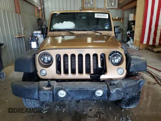 2015 Jeep Wrangler Unlimited Freedom with VIN 1C4BJWDG5FL713046, listed as a Copart auction lot 58563455 with 144,179 mi miles and Salvage title. Bid and sale history available at DreamBid. Image 5.