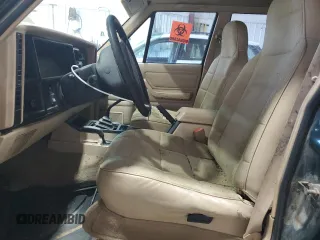 1996 Jeep Cherokee Sport with VIN 1J4FJ68S8TL282160, listed as a Copart auction lot 70670014 with 217,003 mi miles and Clean Title. Bid and sale history available at carsss.com. Image 7.