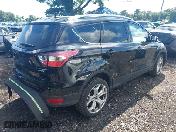 2018 Ford Escape Titanium with VIN 1FMCU9J94JUC98805, listed as a IAAI auction lot 42718214 with 36,689 mi miles and . Bid and sale history available at DreamBid. Image 4.