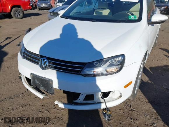 2015 Volkswagen Eos Komfort with VIN WVWBW8AH0FV001011, listed as a IAAI auction lot 41297299 with 81,444 mi miles and . Bid and sale history available at DreamBid. Image 6.