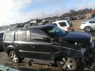 2012 Honda Pilot Touring with VIN 5FNYF3H90CB035309, listed as a IAAI auction lot 41063215 with 228,081 mi miles and . Bid and sale history available at carsss.com. Image 13.