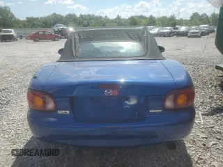 1999 Mazda MX-5 Miata with VIN JM1NB353XX0134898, listed as a Copart auction lot 63429475 with 140,595 mi miles and Clean title. Bid and sale history available at DreamBid. Image 6.