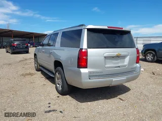 2020 Chevrolet Suburban Premier with VIN 1GNSCJKCXLR219679, listed as a IAAI auction lot 41806579 with 90,132 mi miles. Bid and sale history available at carsss.com. Image 3.