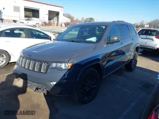 2018 Jeep Grand Cherokee Laredo E with VIN 1C4RJFAGXJC147400, listed as a IAAI auction lot 41358662 with 97,184 mi miles. Bid and sale history available at carsss.com. Image 2.