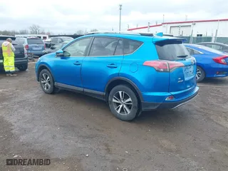 2017 Toyota RAV4 XLE with VIN JTMRFREV4HJ123496, listed as a IAAI auction lot 42068817 with 211,682 mi miles. Bid and sale history available at carsss.com. Image 3.