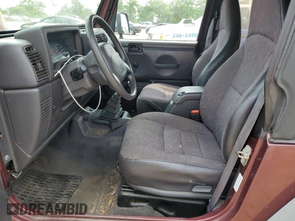 2002 Jeep Wrangler X z VIN 1J4FA39S42P773815, wystawiony jako Copart lot #60016255 z przebiegiem 174 803 mil mil oraz Szkoda całkowita • Salvage title. Historia ofert i sprzedaży dostępna na DreamBid. Obrazek 7.