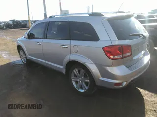 2014 Dodge Journey Limited with VIN 3C4PDCDG9ET157841, listed as a IAAI auction lot 41609646 with 130,329 mi miles and . Bid and sale history available at DreamBid. Image 3.