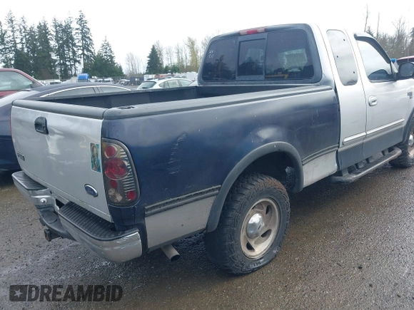 2000 Ford F-150 XL z VIN 1FTRX18L8YKA72409, wystawiony jako IAAI lot #41928360 z przebiegiem 167 251 mil mil oraz . Historia ofert i sprzedaży dostępna na DreamBid. Obrazek 4.