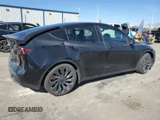 2023 Tesla Model Y Performance with VIN 7SAYGDEF7PF924355, listed as a Copart auction lot 47877055 with 64,663 mi miles and Salvage Title. Bid and sale history available at DreamBid. Image 3.