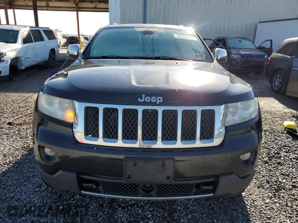2013 Jeep Grand Cherokee Overland with VIN 1C4RJFCG2DC653207, listed as a Copart auction lot 48680885 with 276,020 mi miles and Salvage Title. Bid and sale history available at carsss.com. Image 5.