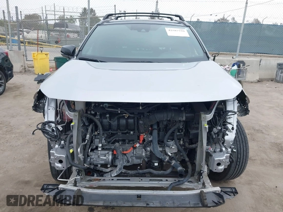 2021 Toyota RAV4 Hybrid XSE z VIN 4T3E6RFV9MU027713, wystawiony jako IAAI lot #42587759 z przebiegiem 28 806 mil mil oraz . Historia ofert i sprzedaży dostępna na DreamBid. Obrazek 13.