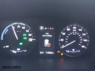 2016 Hyundai Sonata Hybrid SE with VIN KMHE24L12GA037983, listed as a IAAI auction lot 42078321 with 113,998 mi miles. Bid and sale history available at carsss.com. Image 7.