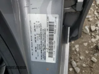 2012 Mazda 3 i Touring with VIN JM1BL1V82C1577583, listed as a Copart auction lot 58669235 with 89,872 mi miles and Salvage title. Bid and sale history available at DreamBid. Image 12.