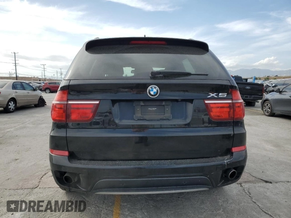 2012 BMW X5 35i z VIN 5UXZV4C51CL989449, wystawiony jako Copart lot #56762095 z przebiegiem 112 576 mil mil oraz Szkoda całkowita • Salvage title. Historia ofert i sprzedaży dostępna na DreamBid. Obrazek 6.