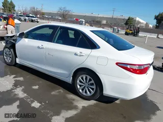2015 Toyota Camry Hybrid LE with VIN 4T1BD1FK9FU155428, listed as a IAAI auction lot 41666063 with 154,608 mi miles. Bid and sale history available at carsss.com. Image 3.
